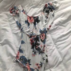 White floral off or on the shoulder body suit